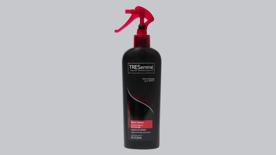 Tresemme Thermal Creations Heat Tamer spray bottle on plain background