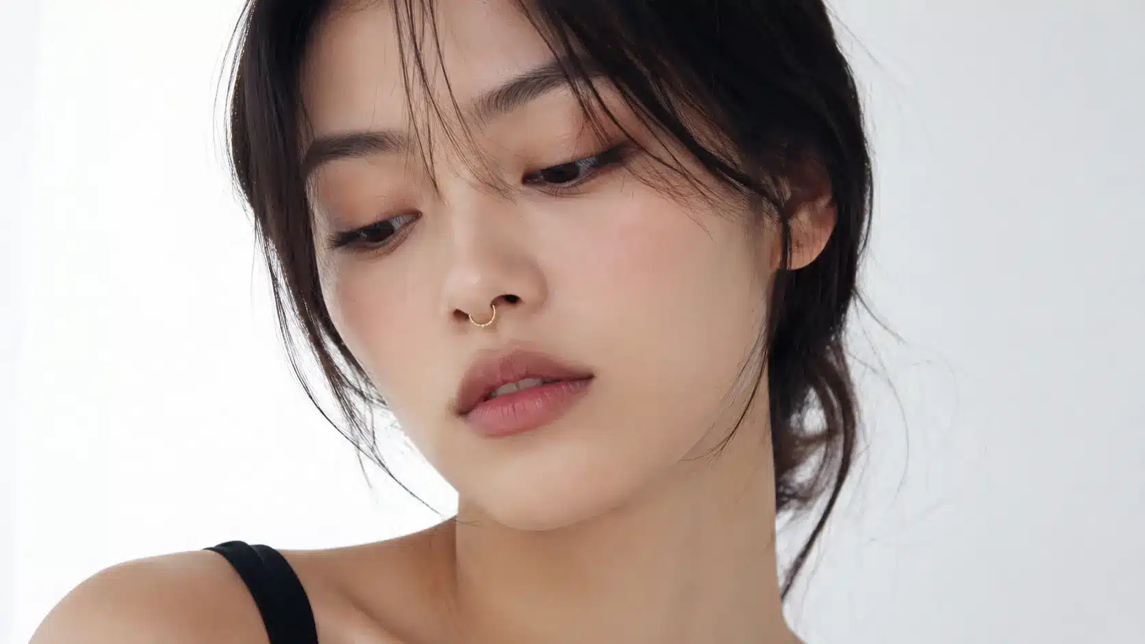 Woman wearing a modern minimalist septum ring