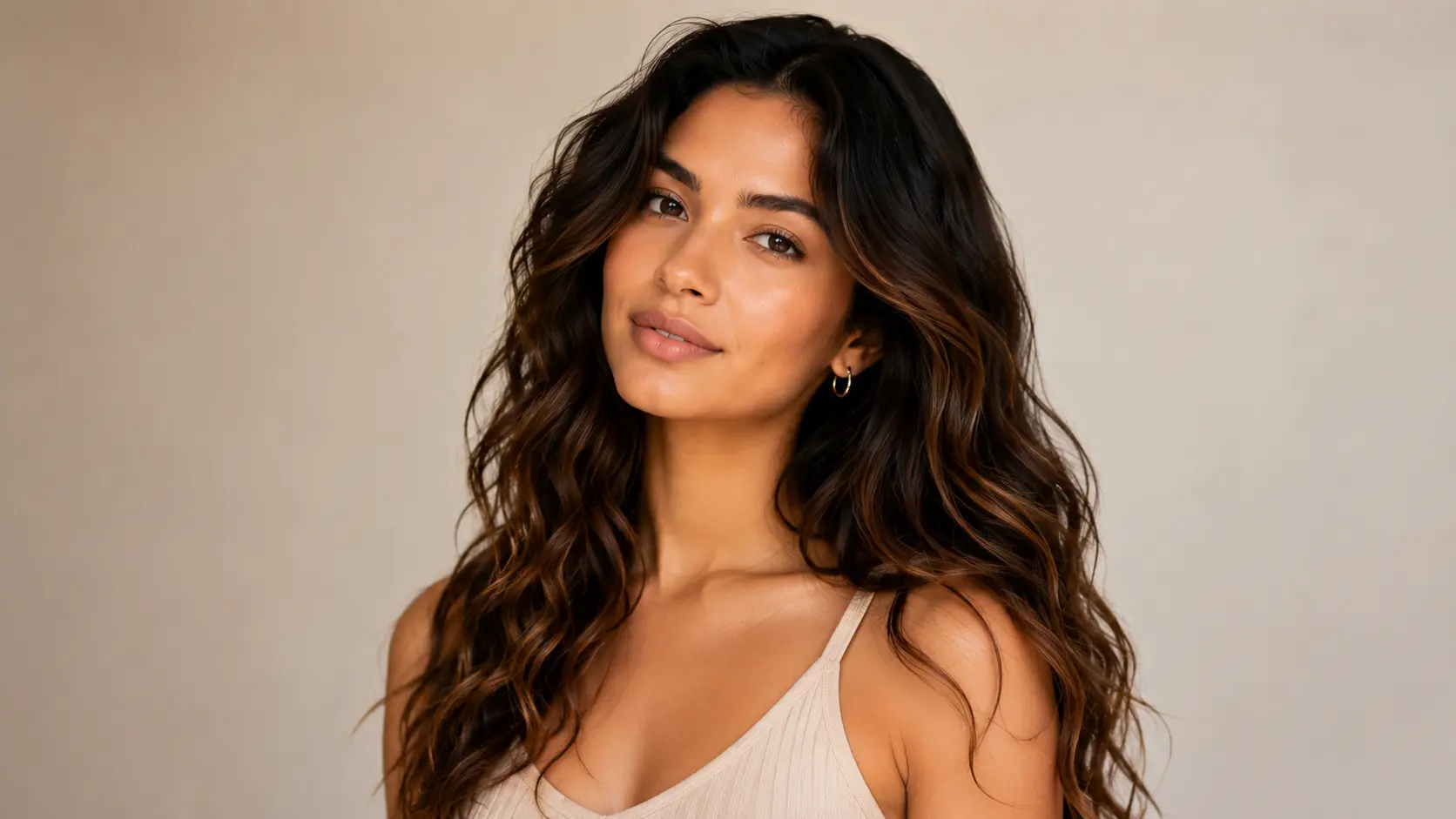 Woman with natural wavy hair showing loose to defined Type 2 wave patterns