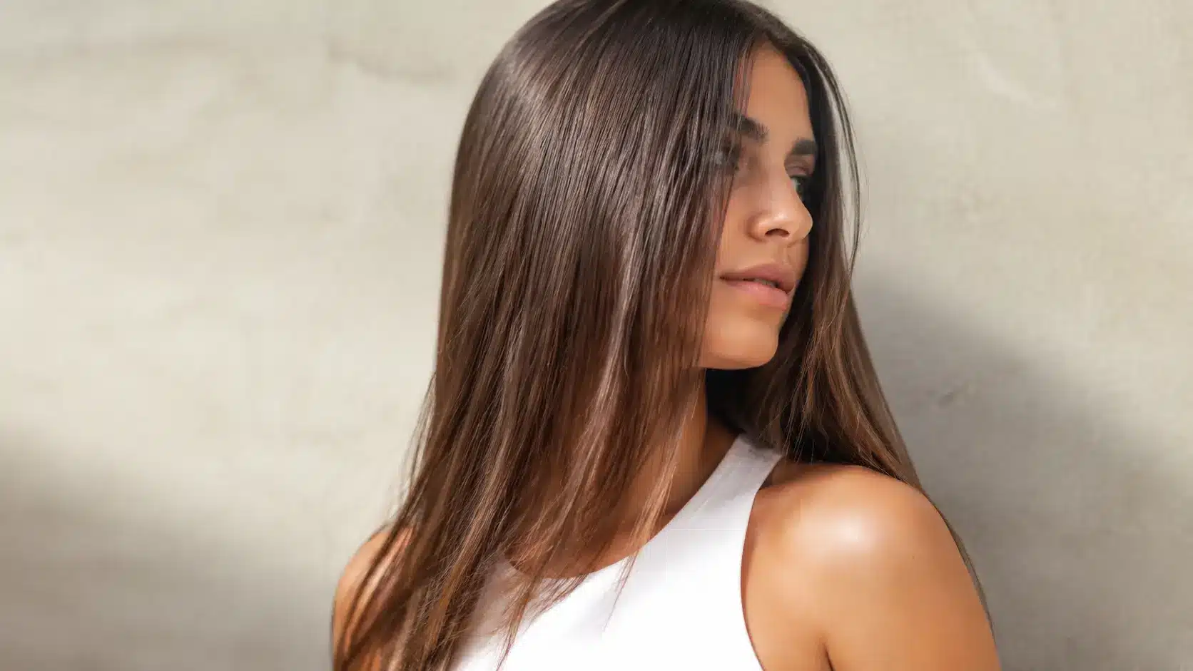 Woman with smooth, healthy straight hair in natural light