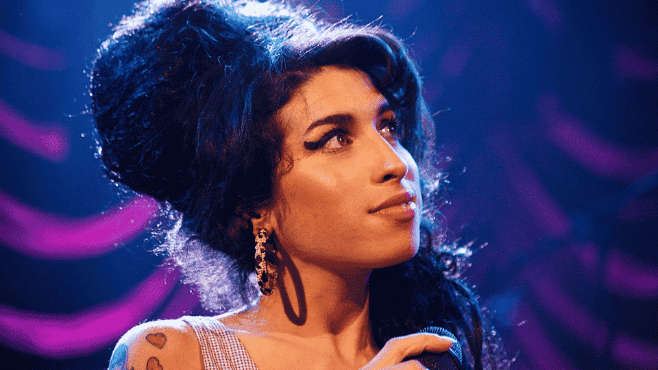 Amy Winehouse in oversized winged eyeliner look during her Back to Black era