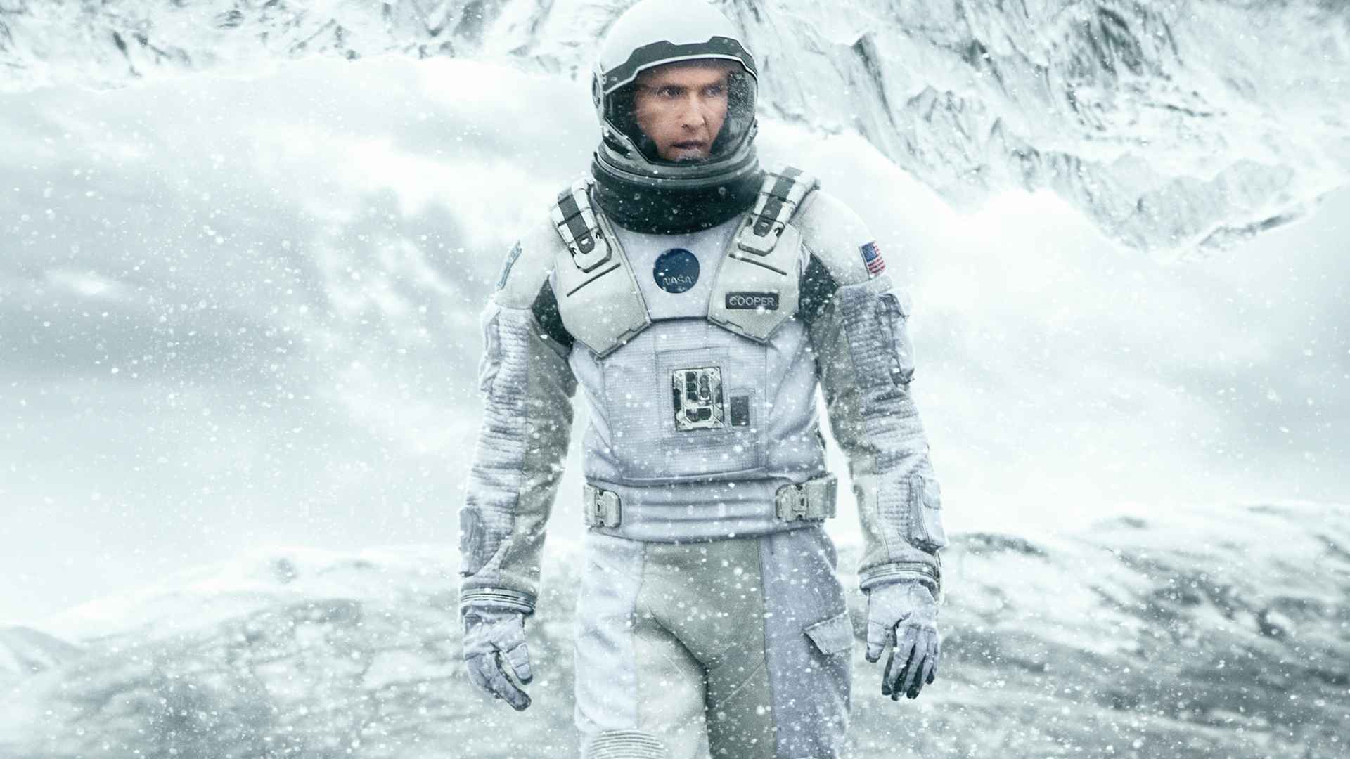 Astronauts walk through shallow water beside the Endurance spacecraft on Miller's planet in a scene from Interstellar.