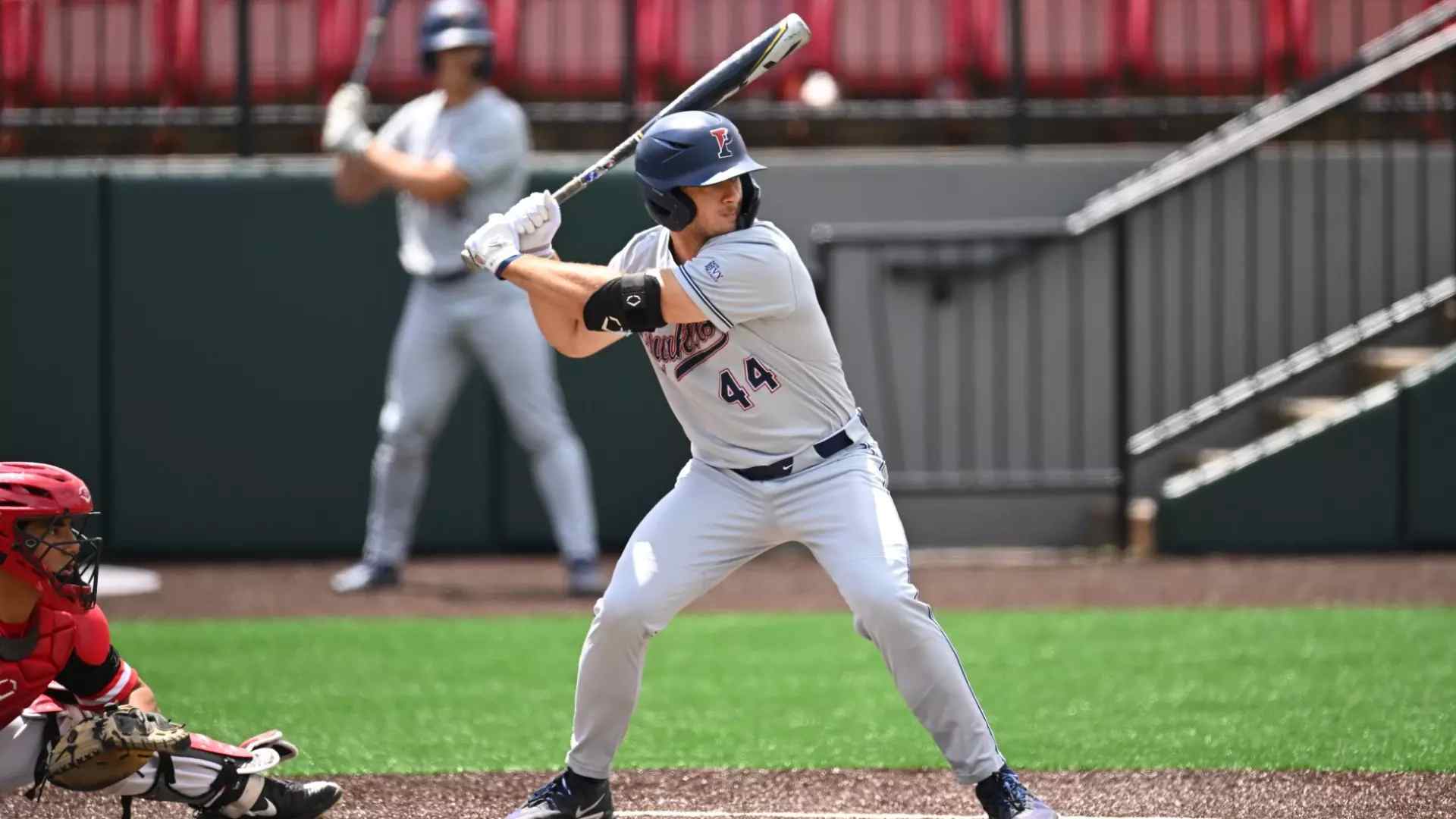Baseball player mid swing showing on field sports analytics in action