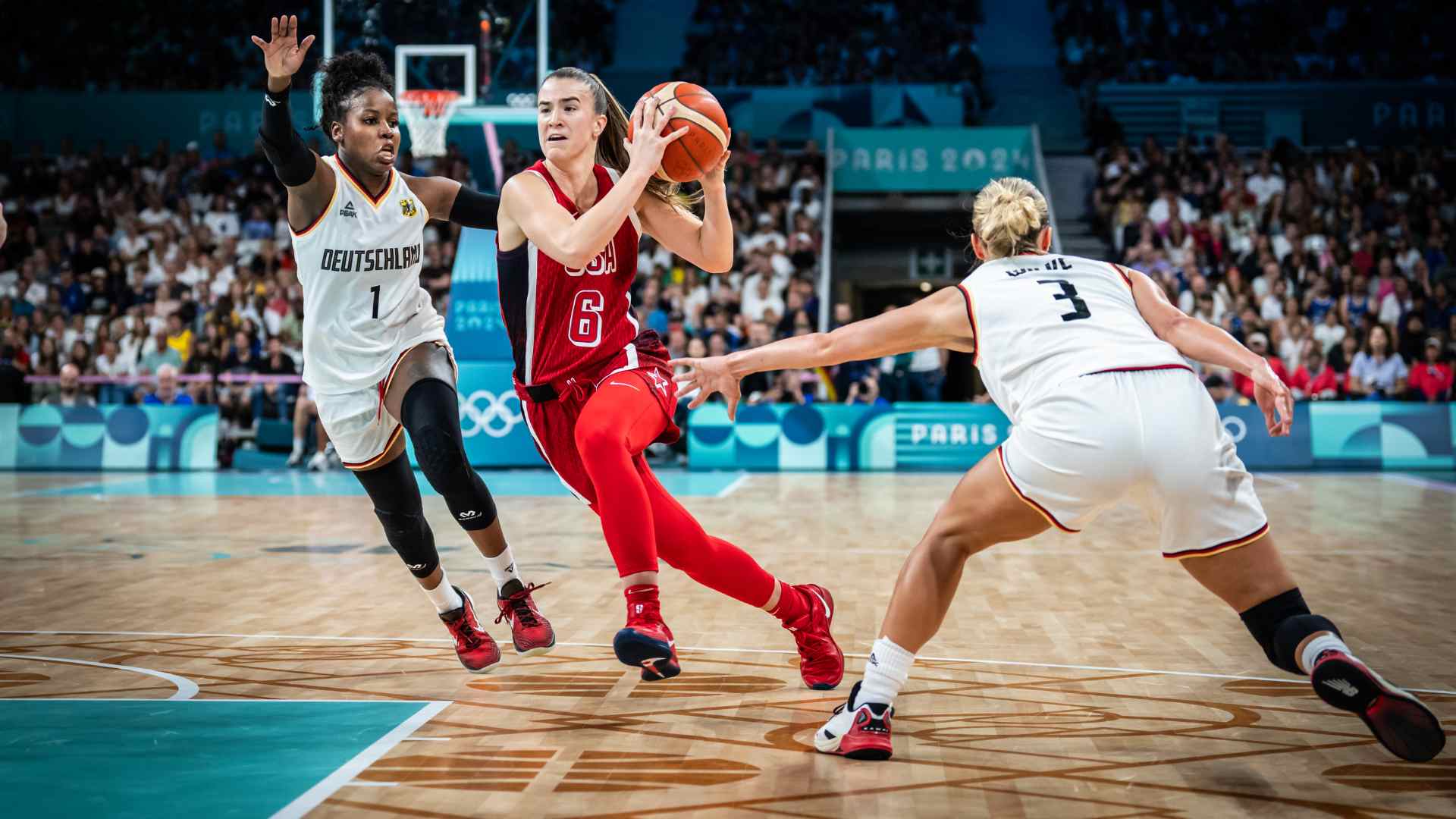 Basketball player driving to the hoop during a game