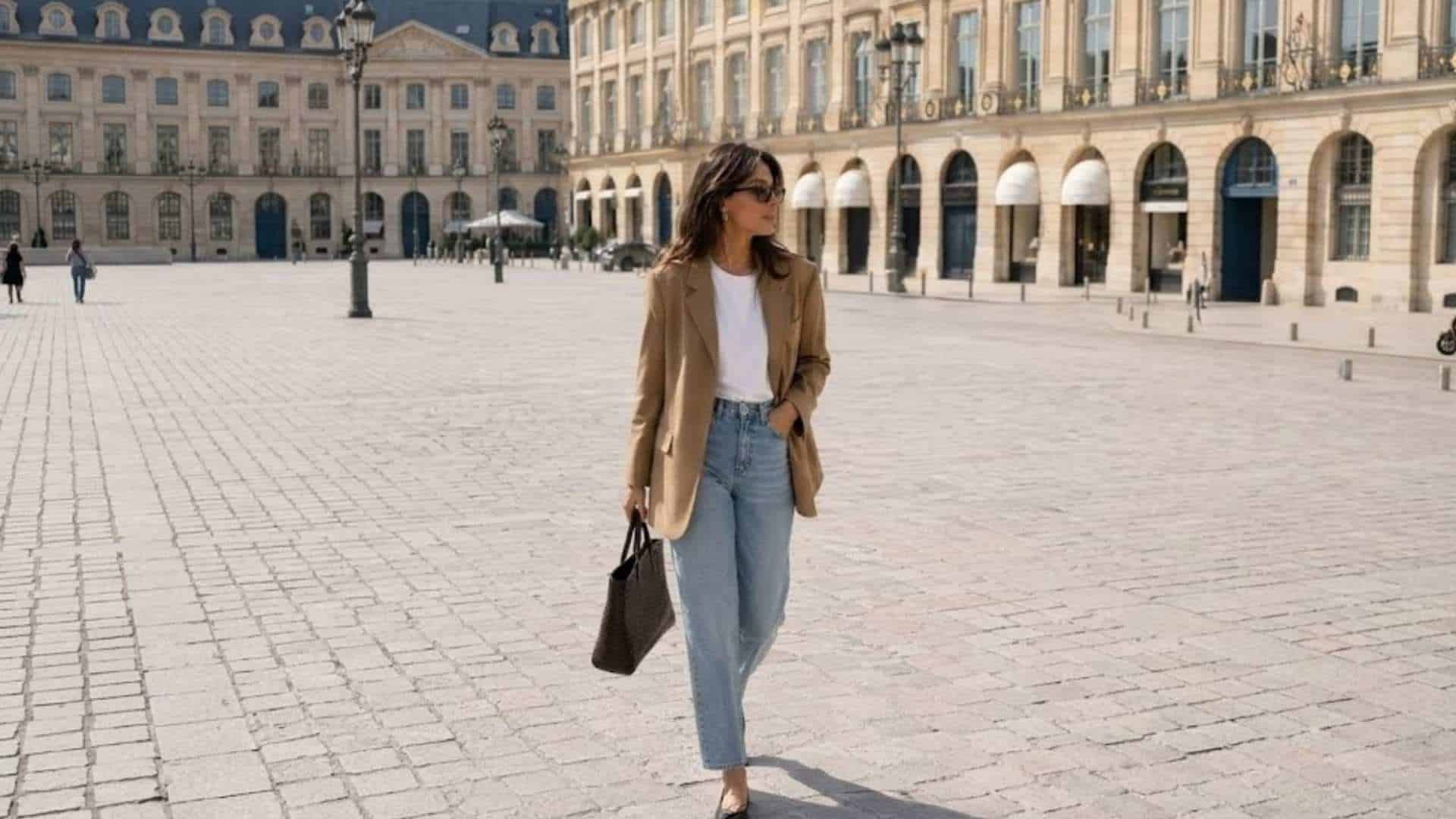 Woman wearing a beige blazer with white tee blue jeans and sneakers for a stylish casual date outfit