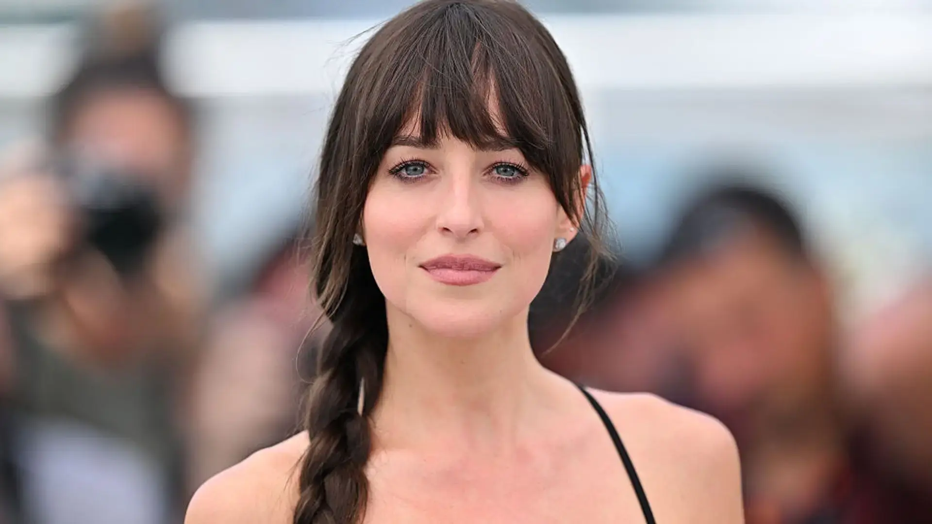 Bottleneck bangs with shorter center fringe and longer face framing pieces on layered hair