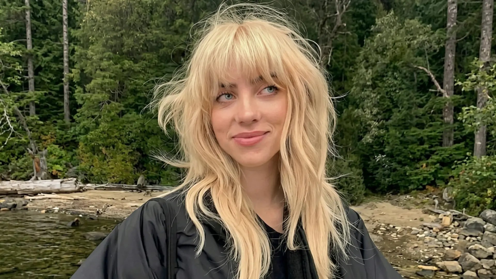 Choppy bangs with uneven textured edges and layered hair for an edgy casual style