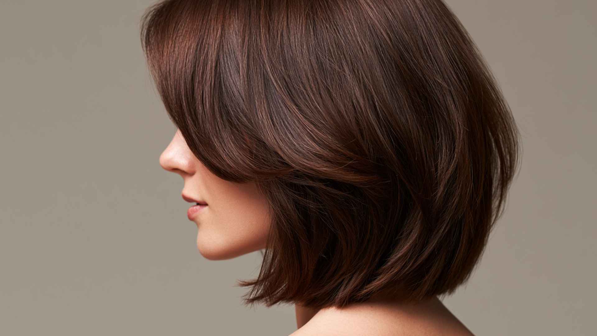 Woman with a collarbone-length layered bob featuring soft layers and natural movement.