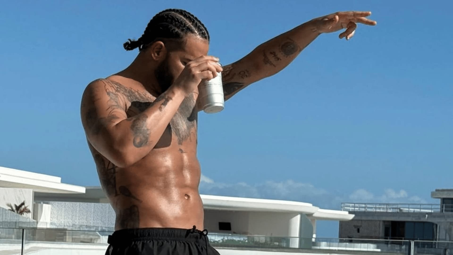 drake-shirtless-abs-rooftop-drink