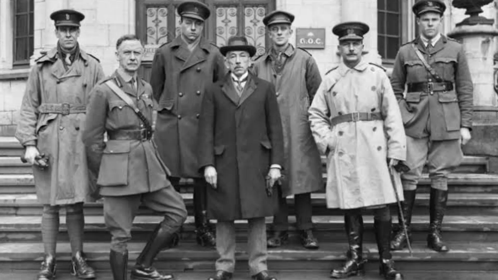 Historical photo of military officers wearing trench coats showing the garment’s early 1900s origins.