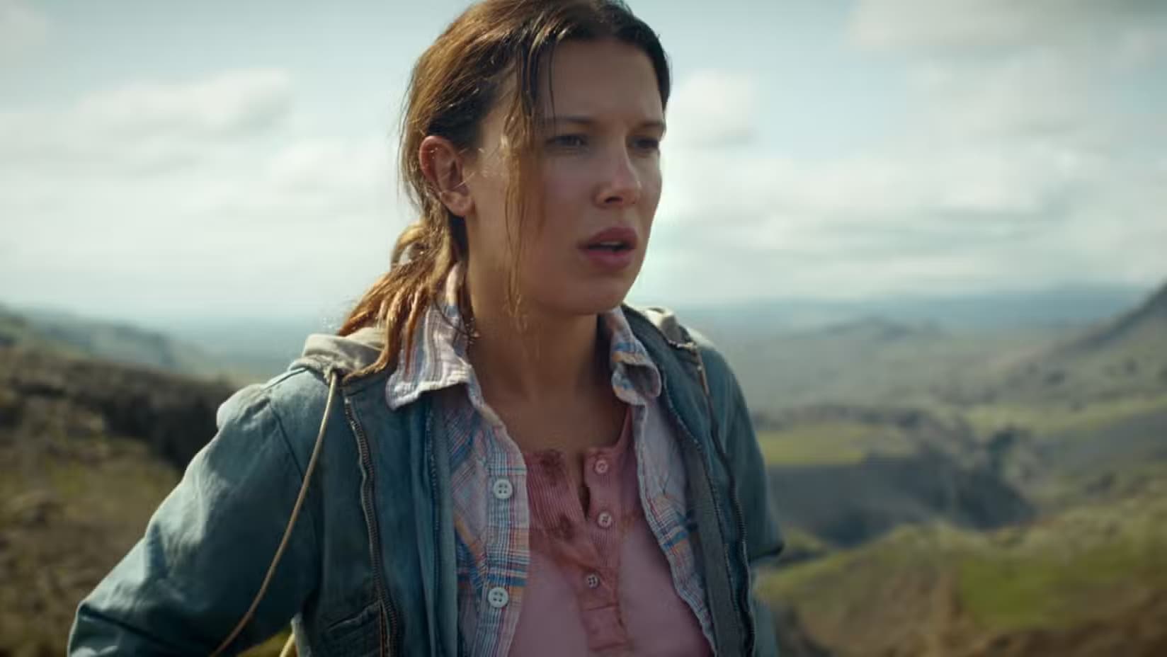 El's wearing a denim jacket, on a hilltop, in Stranger things finale epilogue