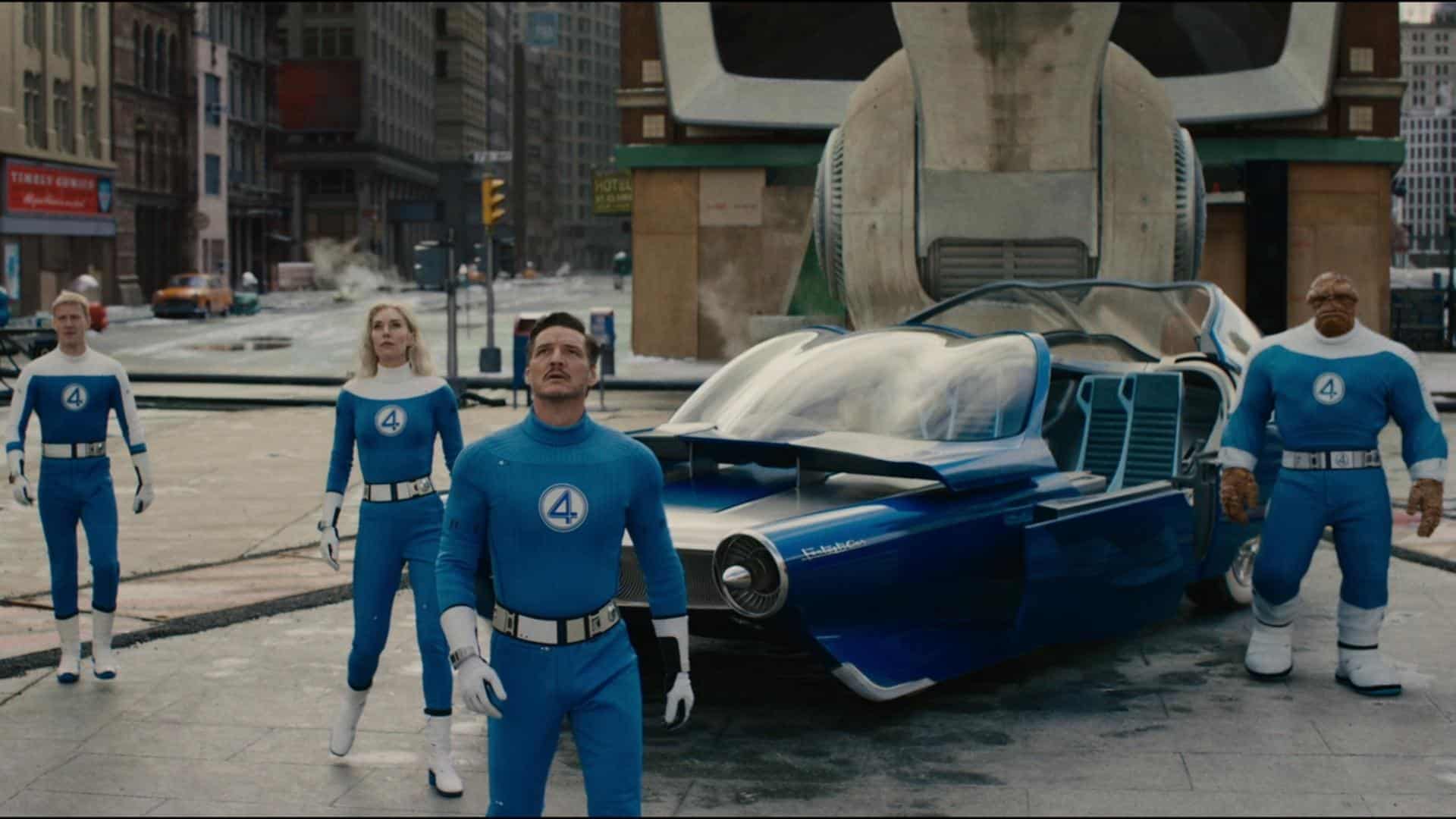 Fantastic Four team in blue retro suits standing before flying car with Galactus looming behind.