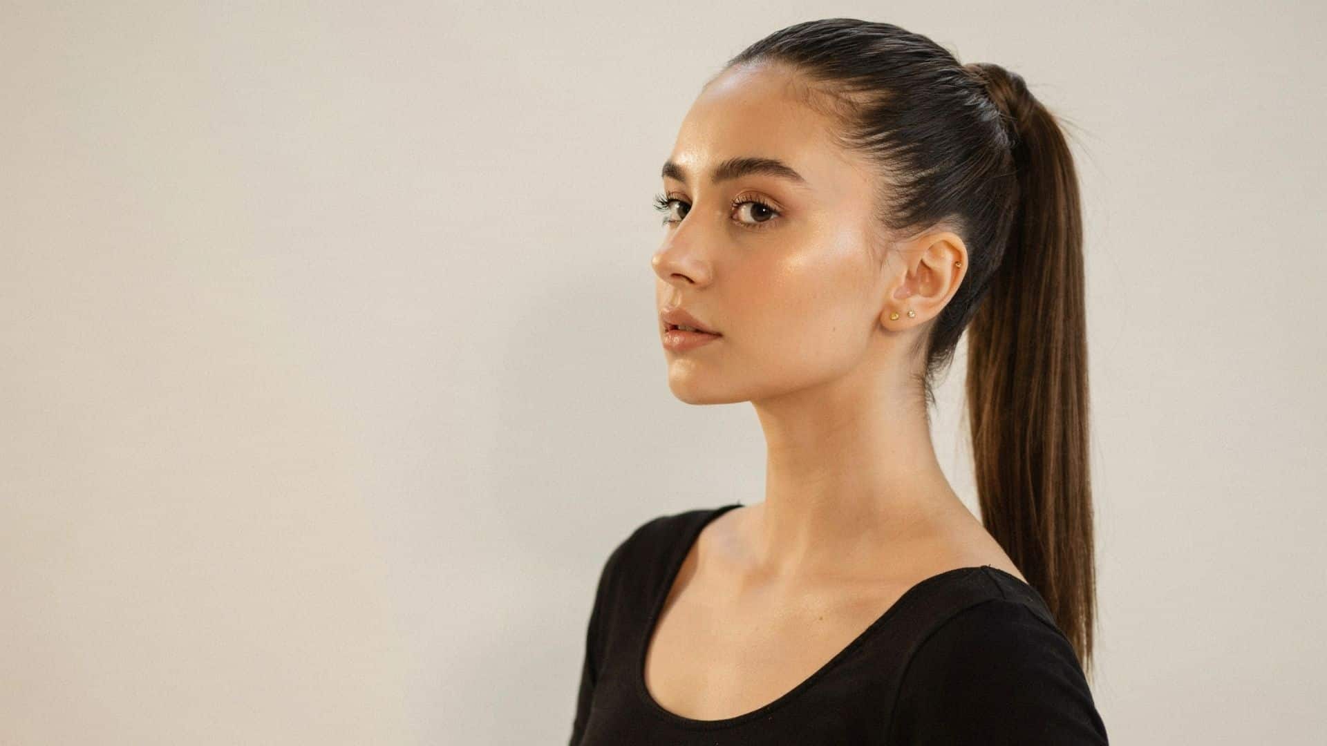 Close-up of a sleek high slicked-back ponytail on straight hair