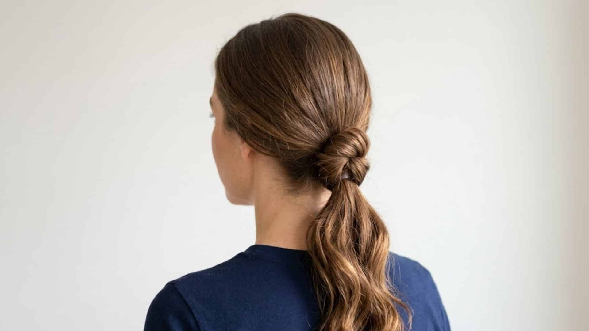 Back view of a low ponytail with a knotted hair detail