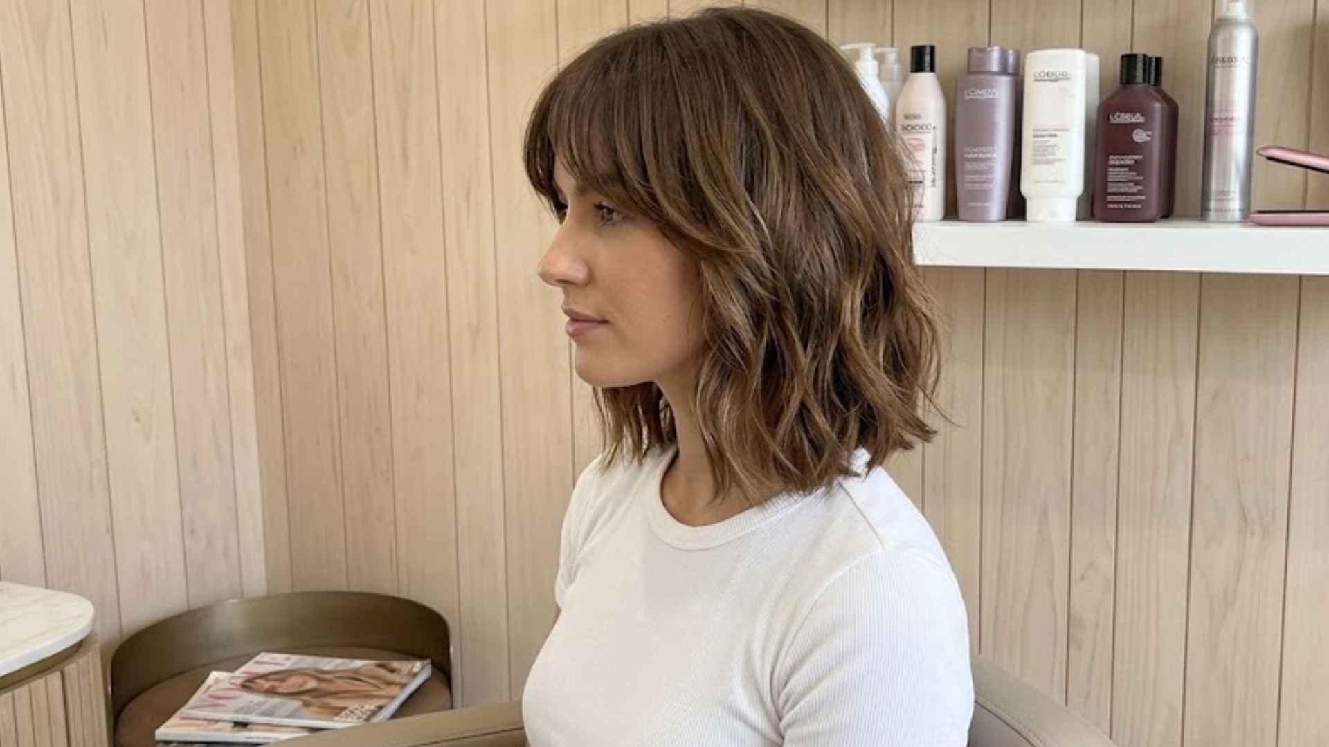 Woman with a piecey textured bob featuring defined layers and separated sections.