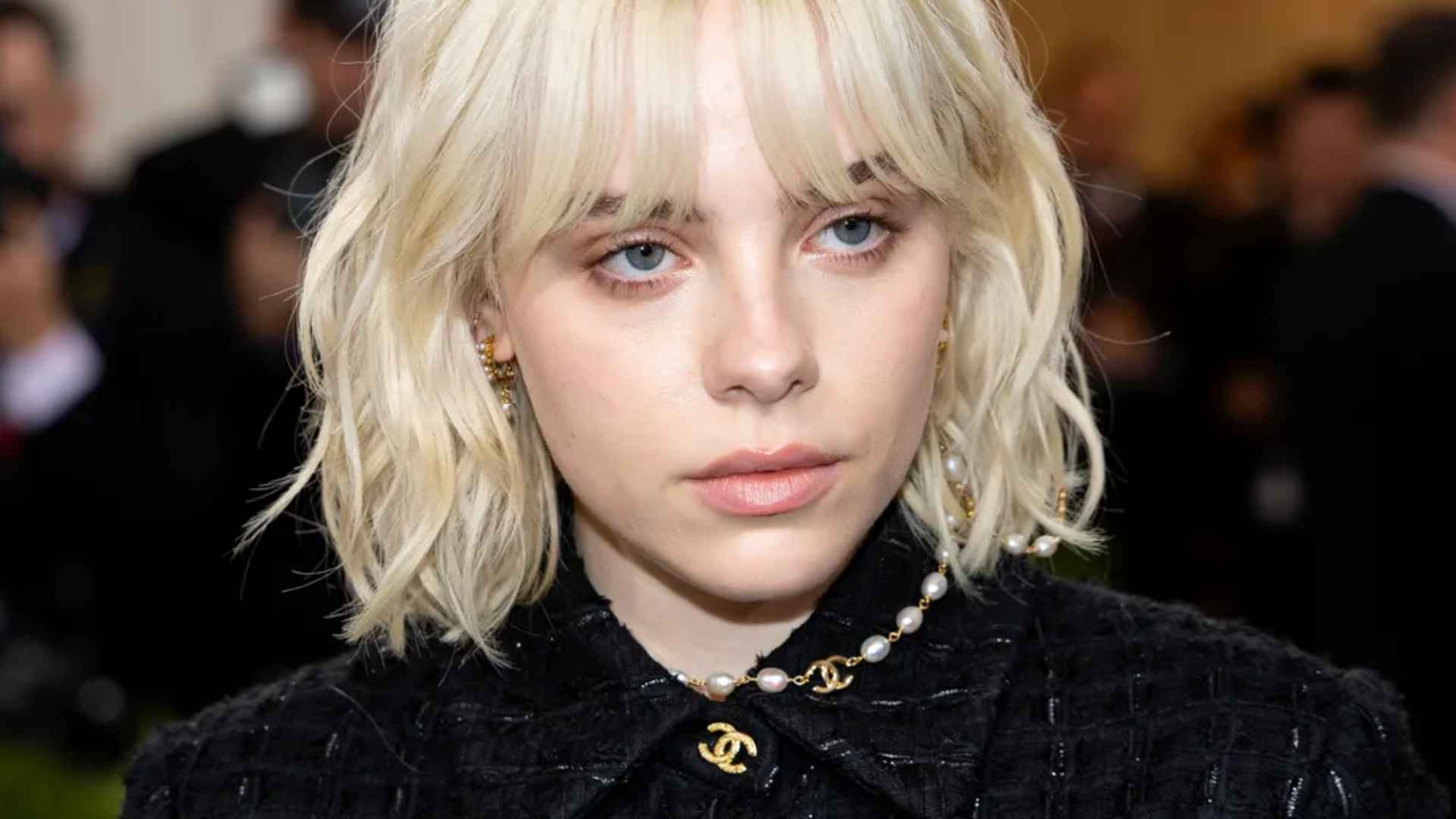 Woman with a wavy layered bob featuring soft beachy waves and natural movement.