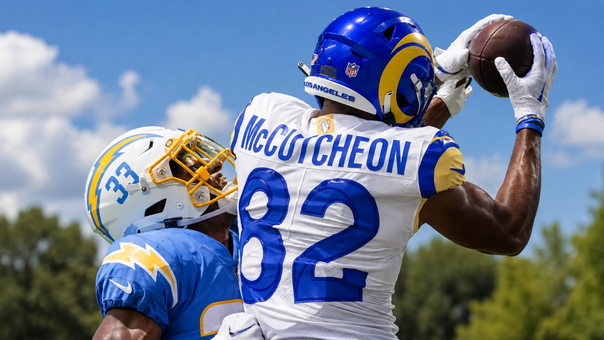 Lance McCutcheon catching a pass in a Rams jersey during a game