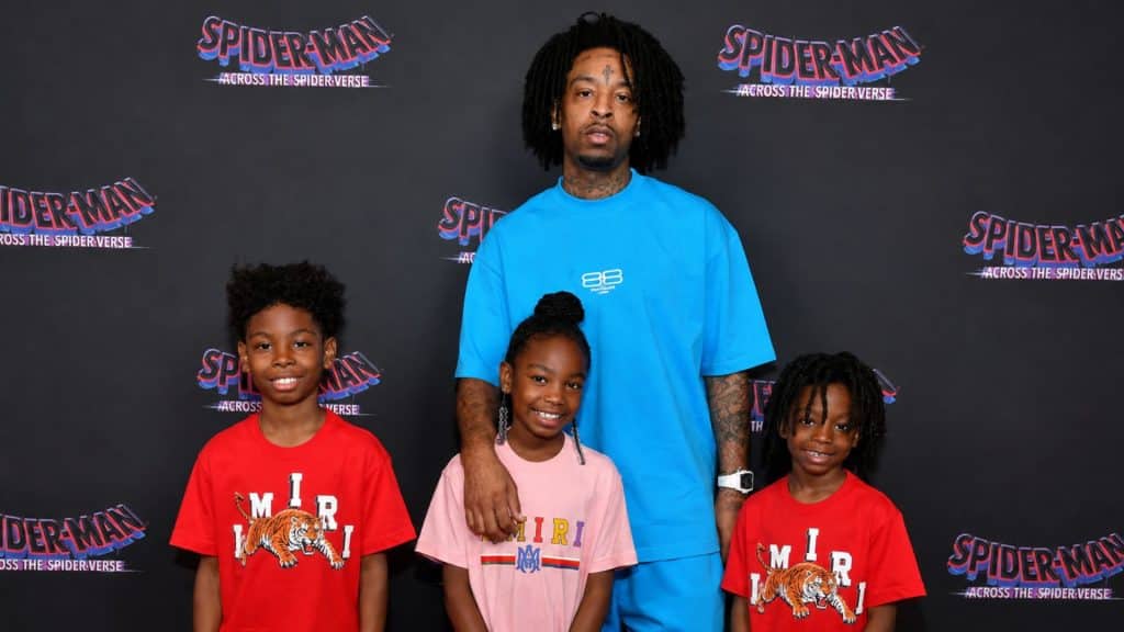 21 Savage posing with his children at the Spider-Man: Across the Spider-Verse premiere event