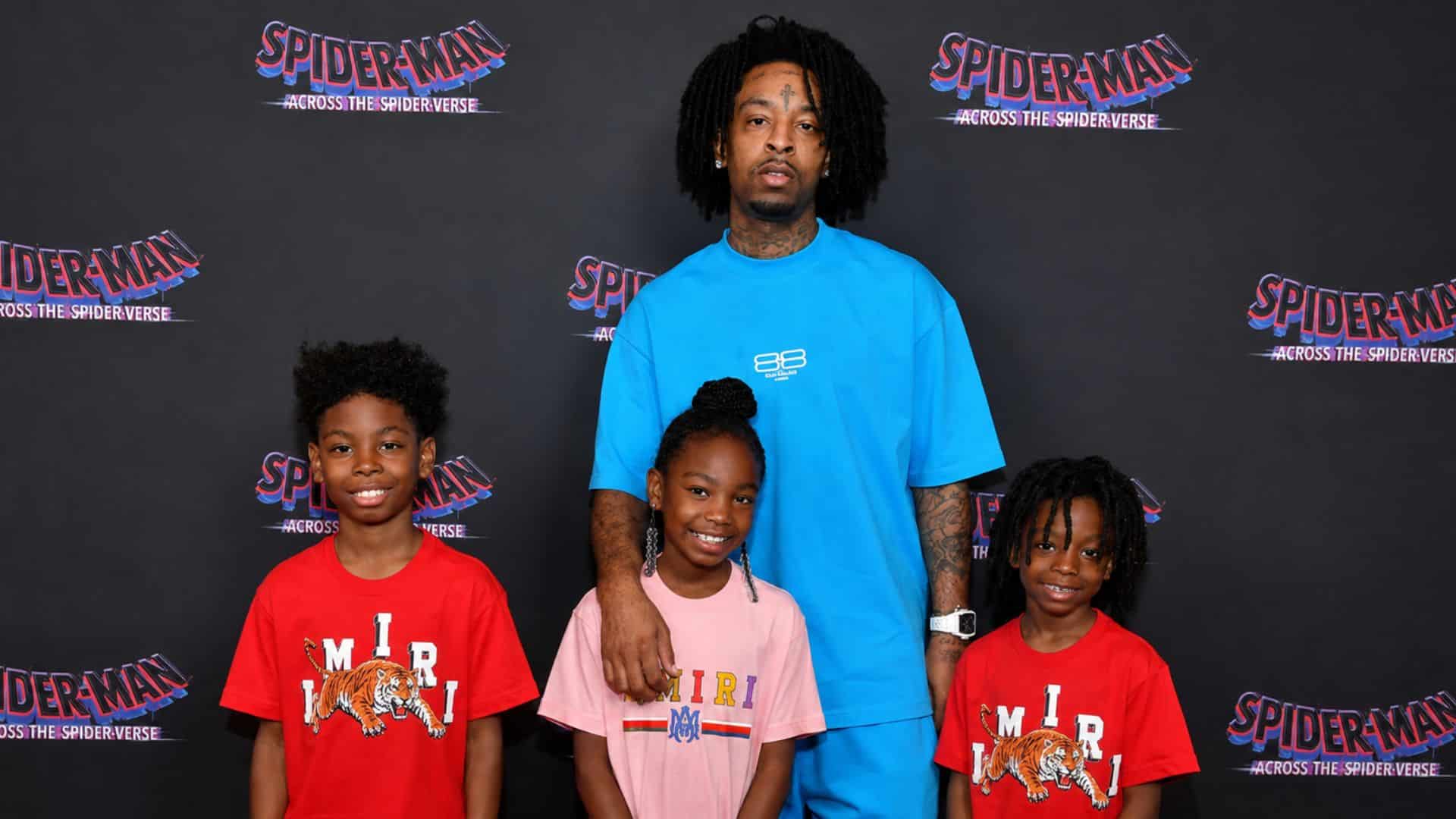 21 Savage posing with his children at the Spider-Man: Across the Spider-Verse premiere event