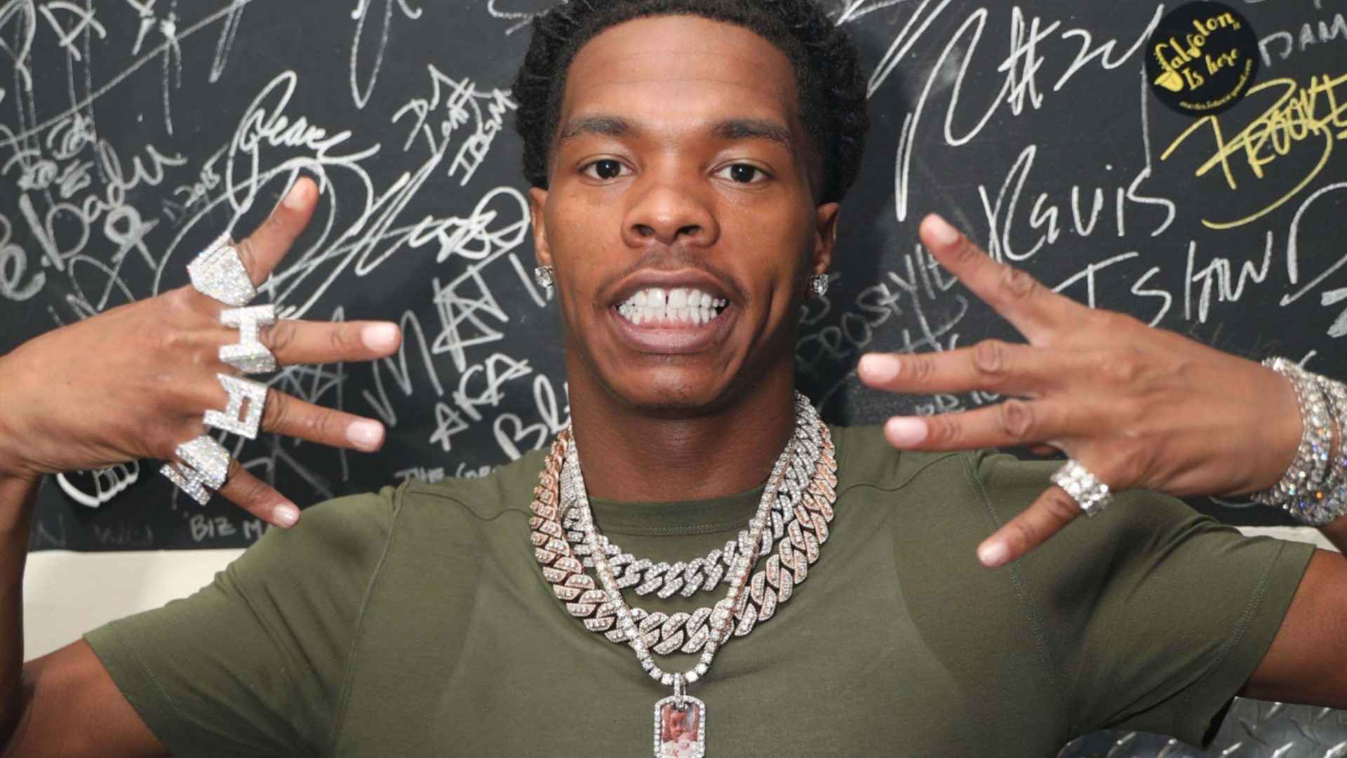 American rapper Lil Baby posing with jewelry and a casual outfit