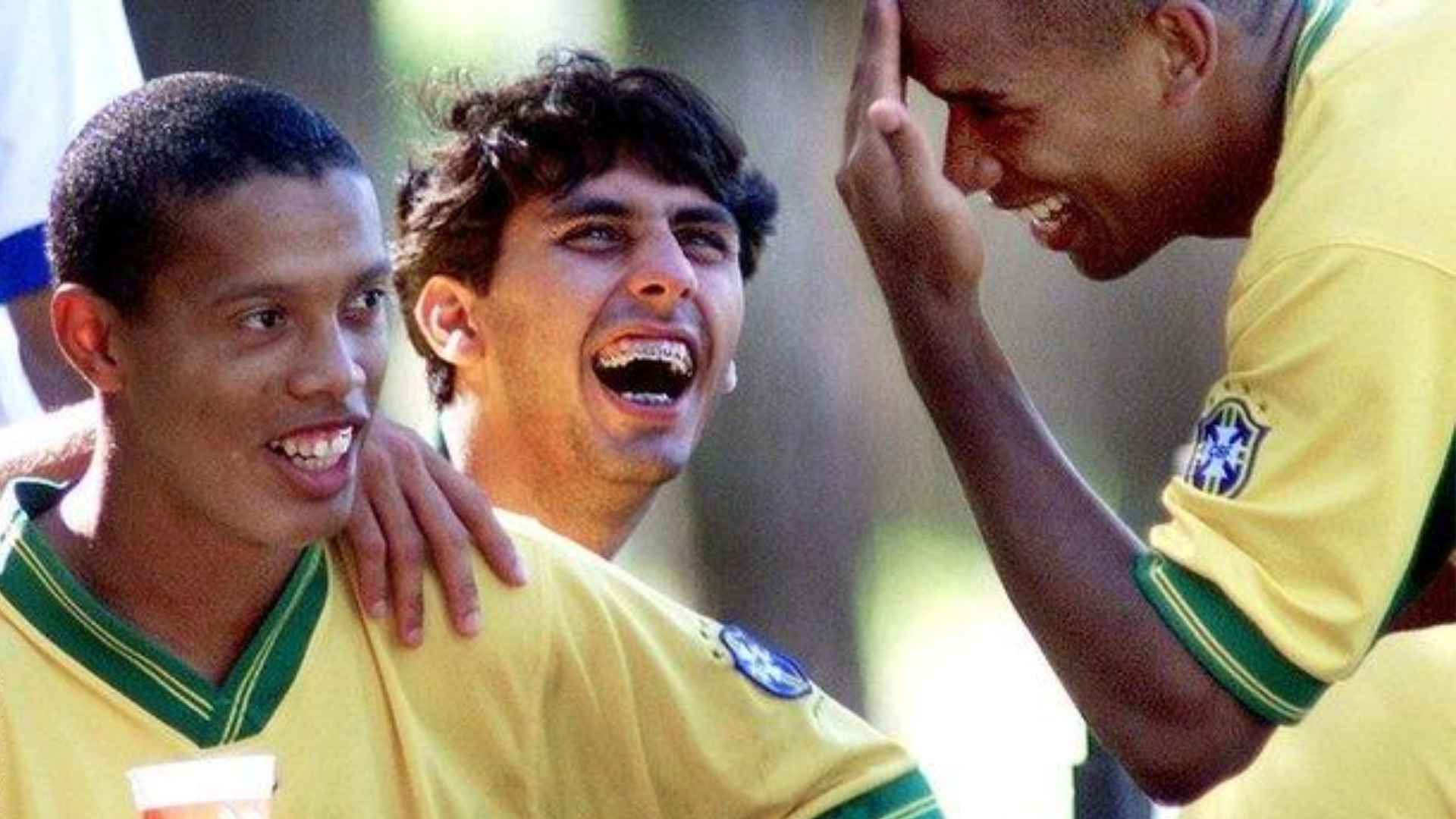 Ronaldinho wearing Brazil football jersey smiling with teammates during a joyful moment from his early football career