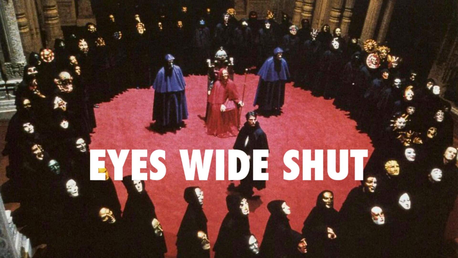 Masked, cloaked figures circling a red carpeted room,