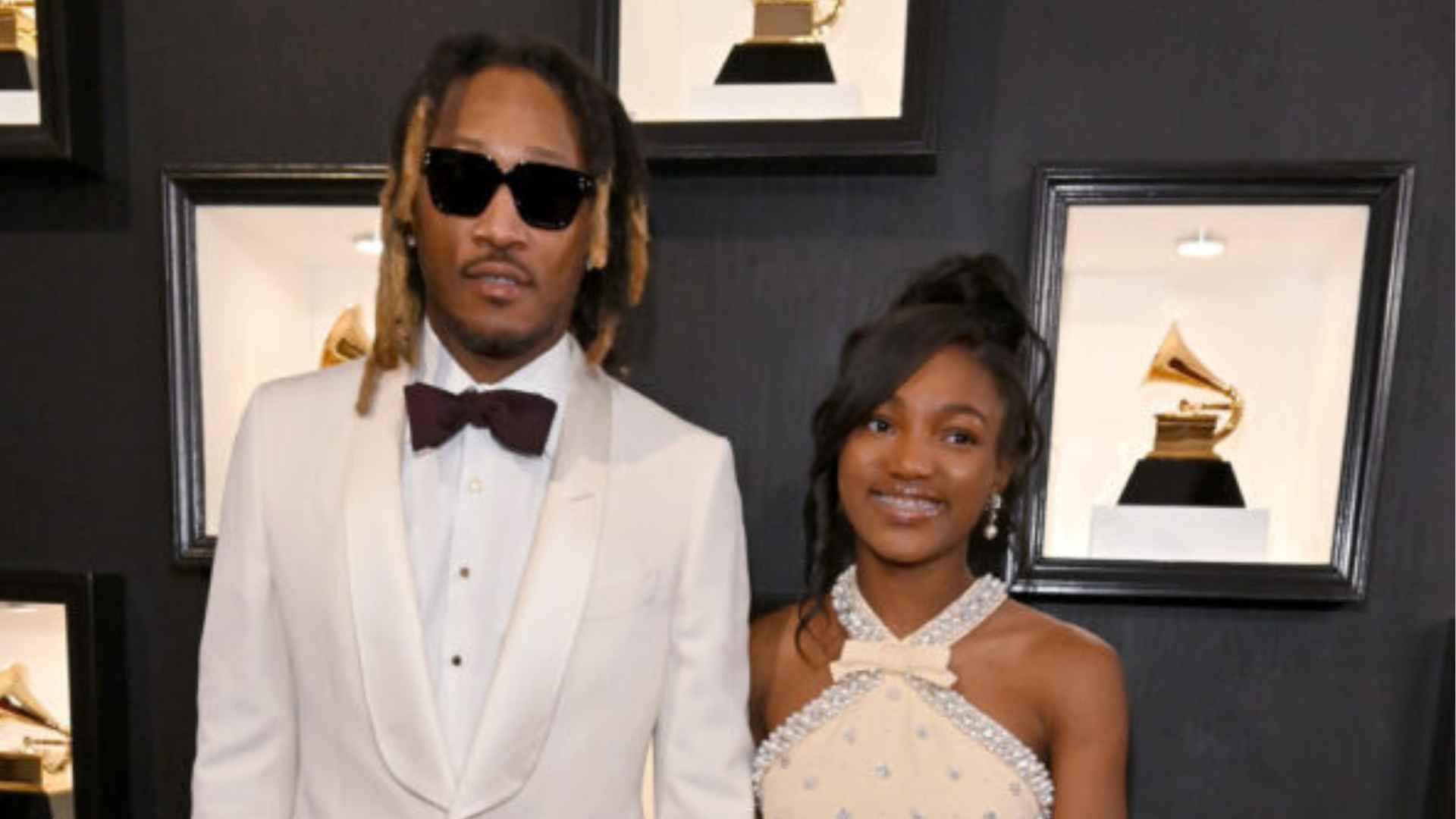 Future posing with his daughter Londyn Wilburn on the red carpet at an event.