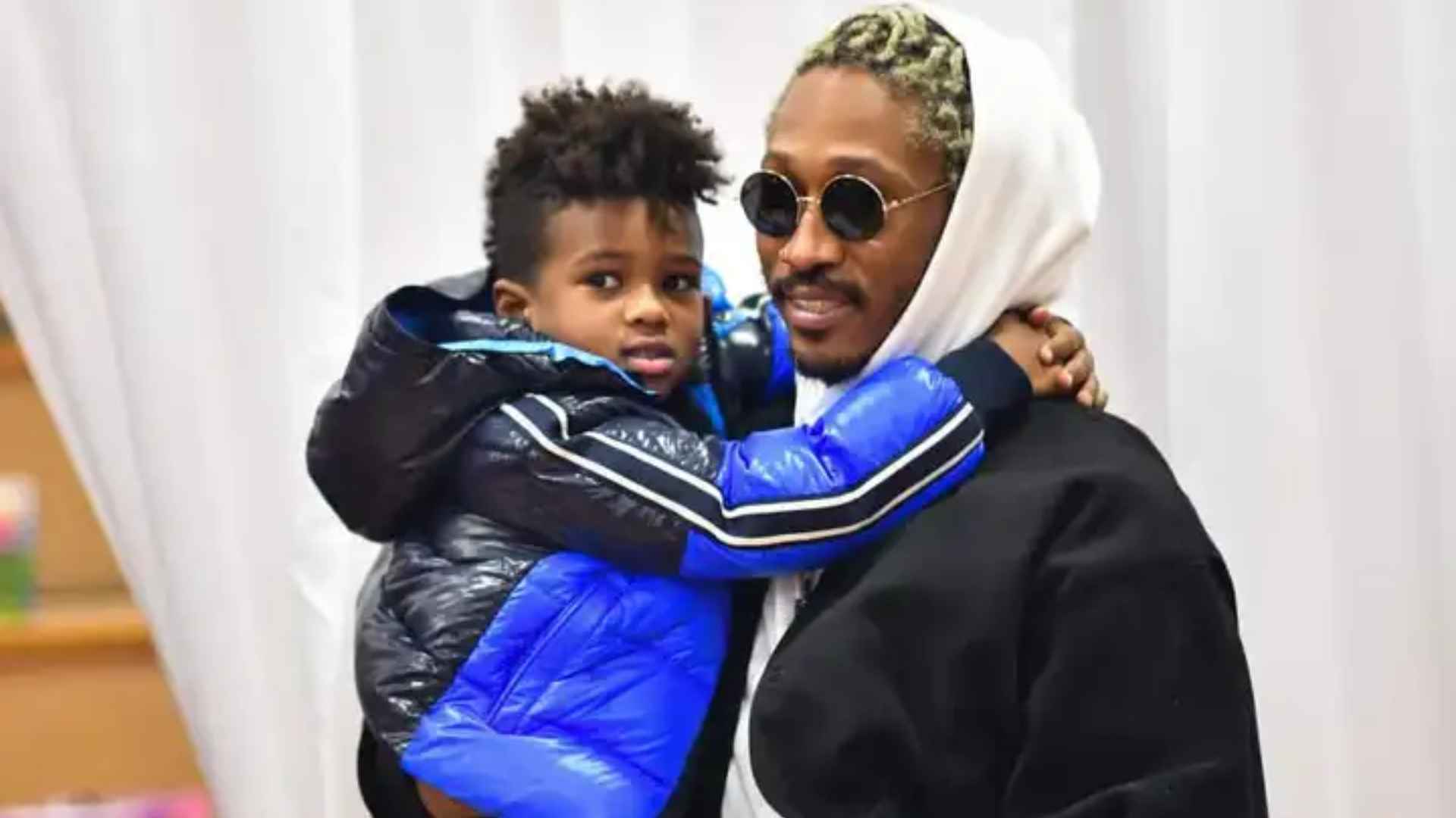 Future posing with his son Future Zahir Wilburn at a family event.
