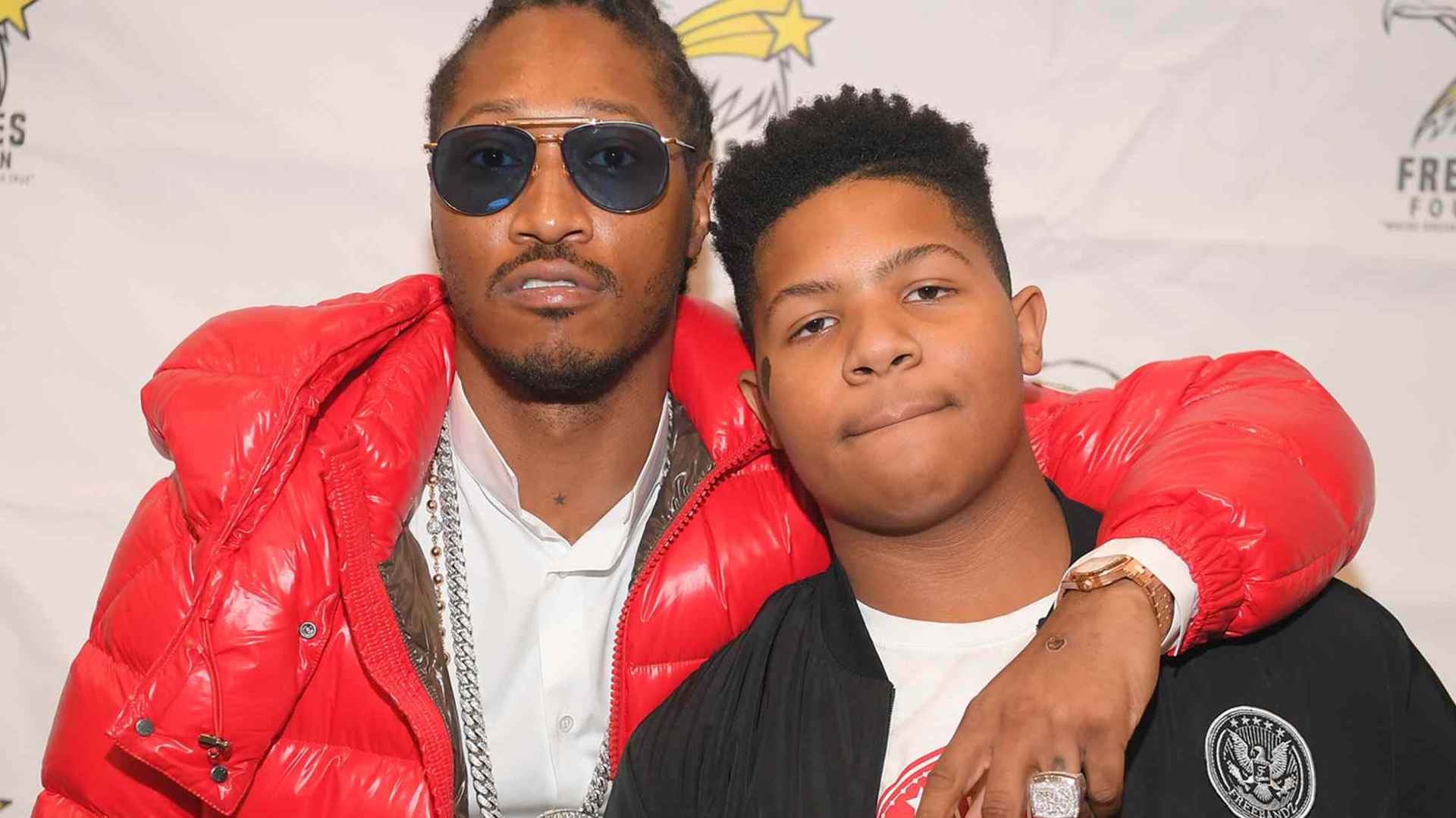 Future posing with his son Jakobi Wilburn at a public event.