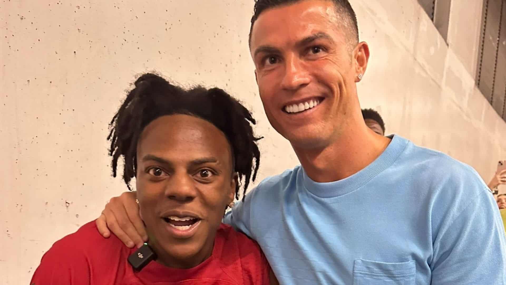 IShowSpeed smiling beside Cristiano Ronaldo during a public meeting with both personalities standing together