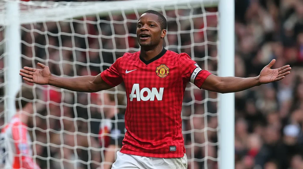 Patrice Evra celebrating a football victory during his years as a Manchester United defender