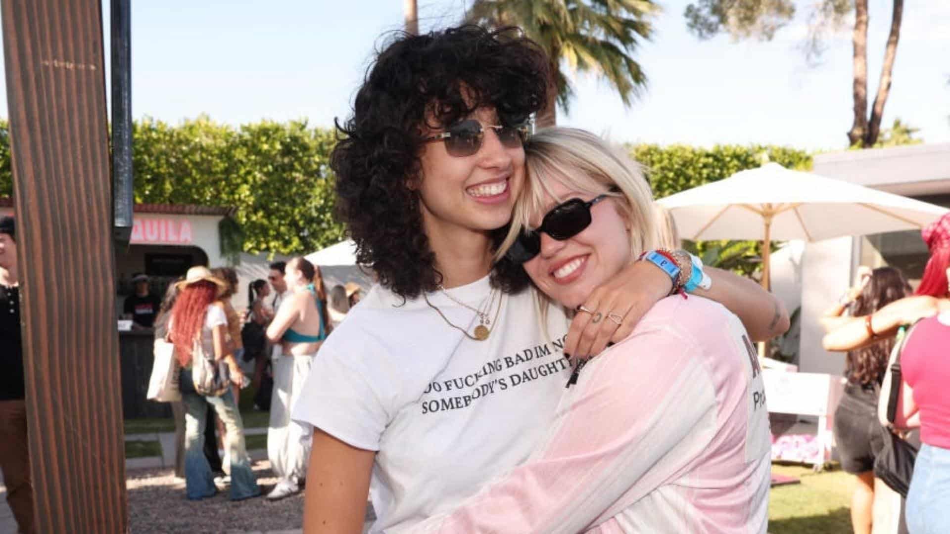 Reneé Rapp and Towa Bird smiling together at Coachella during a public appearance.