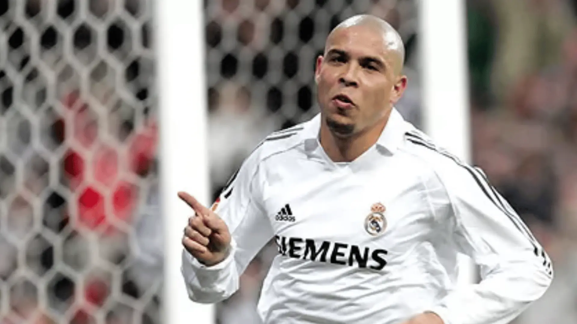 Ronaldo Nazário celebrates a goal while wearing Real Madrid’s white soccer jersey.