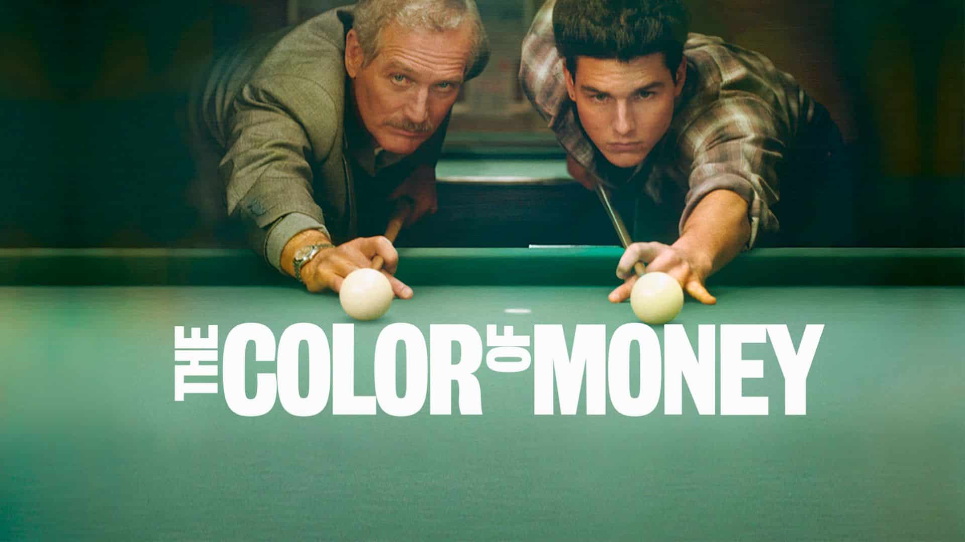 Two men leaning over a pool table with cue balls,