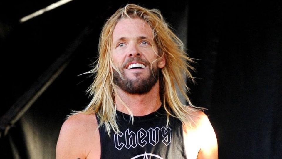 Taylor Hawkins performing live behind his custom drum kit at a concert