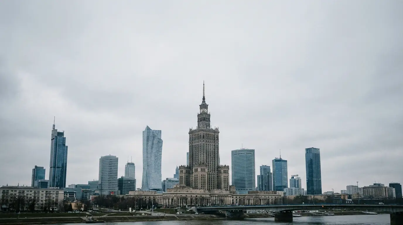 Tall modern skyscrapers surrounding a historic building under cloudy sky in city center skyline