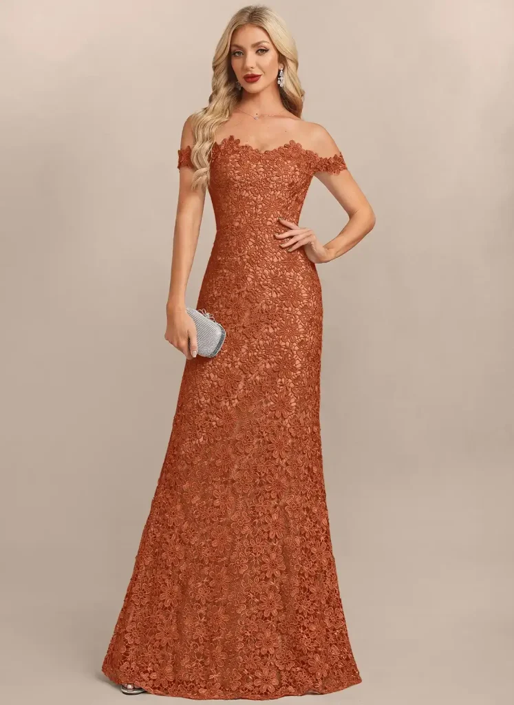 Elegant woman in an off-shoulder lace gown holding a silver clutch in neutral setting