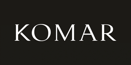Black background with the word KOMAR in white capital letters