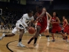 Junior guard Brittany Willson works to dribble past the Louisville Cardinal forward Shawnta' Dyer. The Buffs won 70-66. (Amy Leder/CU Independent)