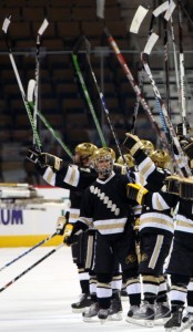 The CU team salutes fans in the stands of the Pepsi Center at the end of their winning game Saturday night. (CU Independent/Adam Alberti)